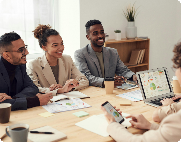People in meeting smiling
